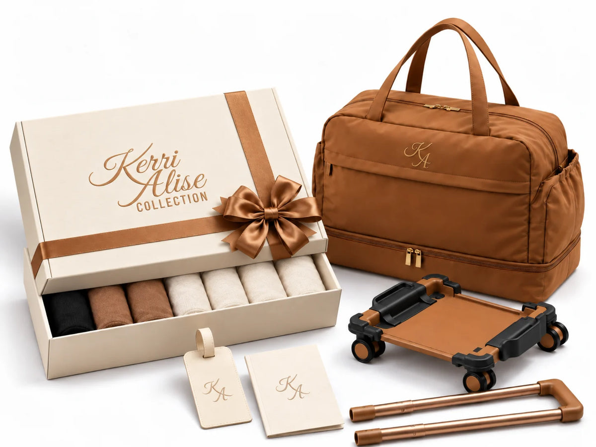 Kerri Alise travel capsule gift box beside a camel Weekender Duffel and detachable trolley components